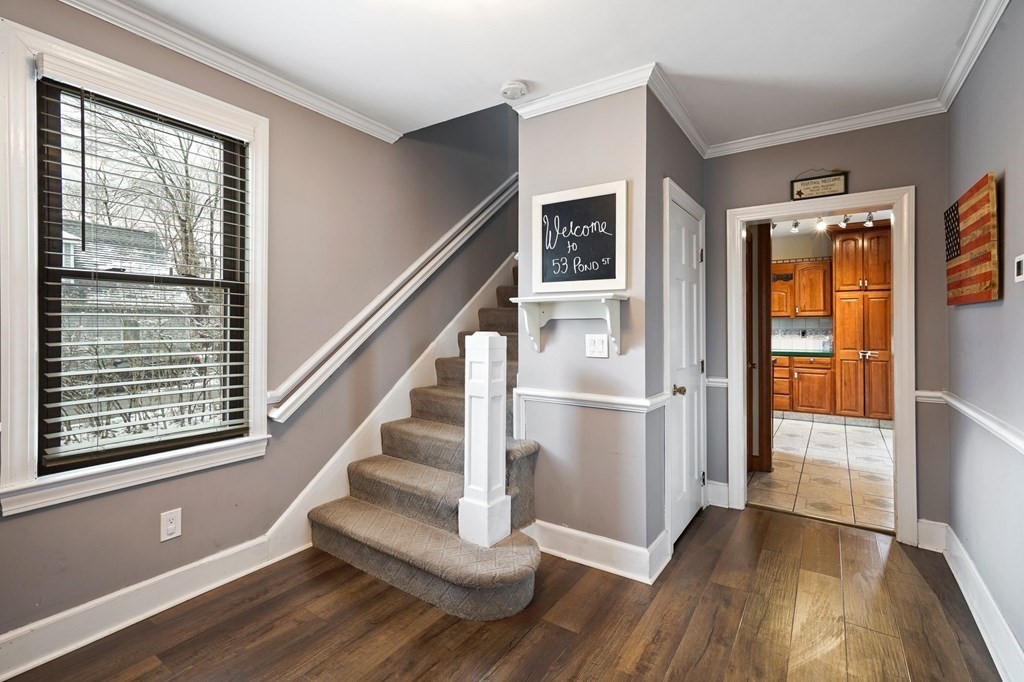 53 Pond Street Canton, MA 02021 - Photo 4 of 31 a view of entryway and hall with wooden floor