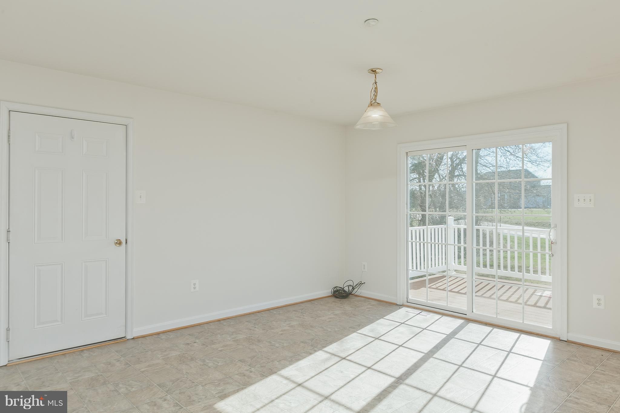 14613 Toll Road New Windsor, MD 21776 - Photo 12 of 30 wooden floor in an empty room with a window
