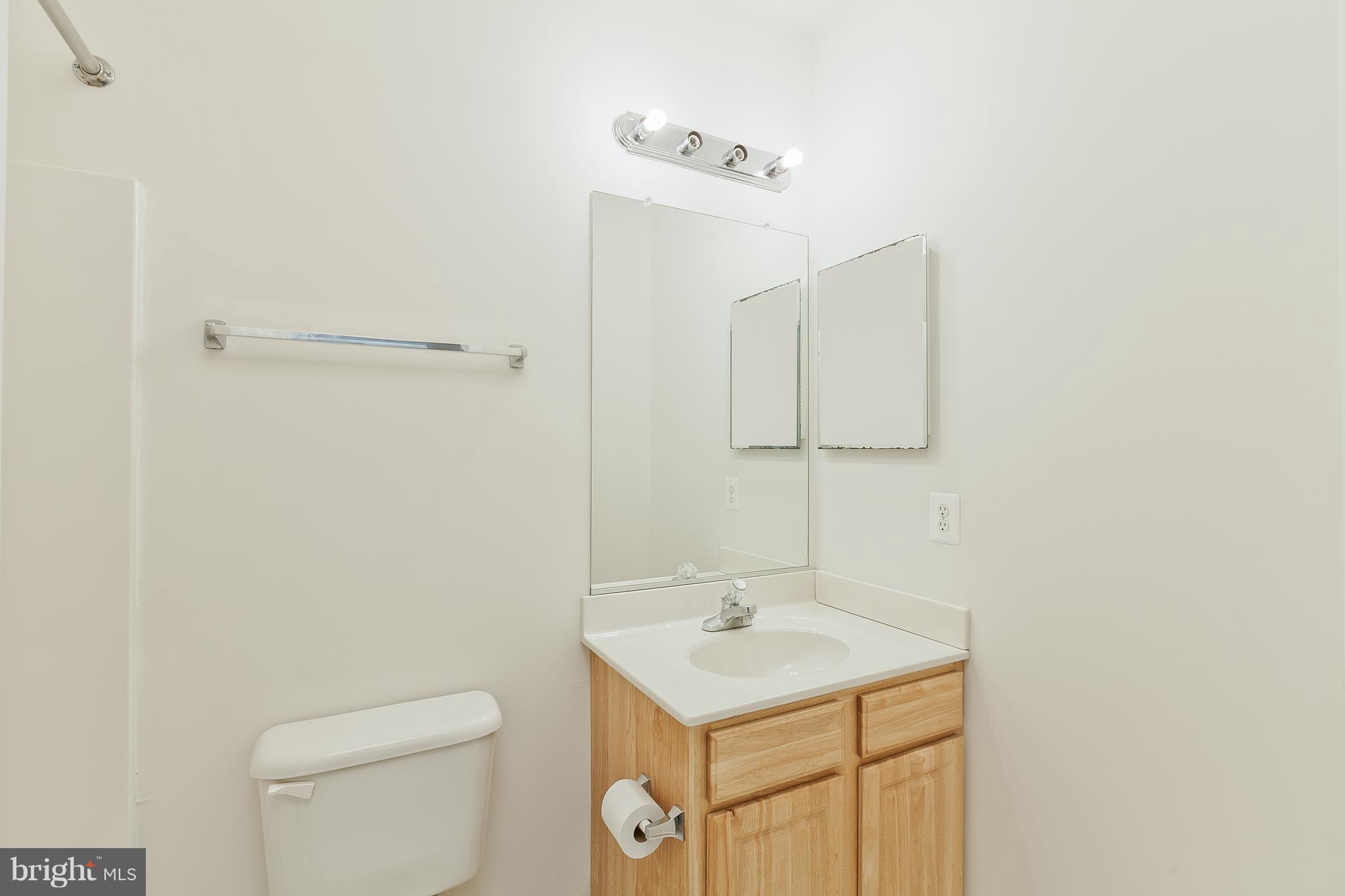14613 Toll Road New Windsor, MD 21776 - Photo 14 of 30 a bathroom with a sink toilet and vanity