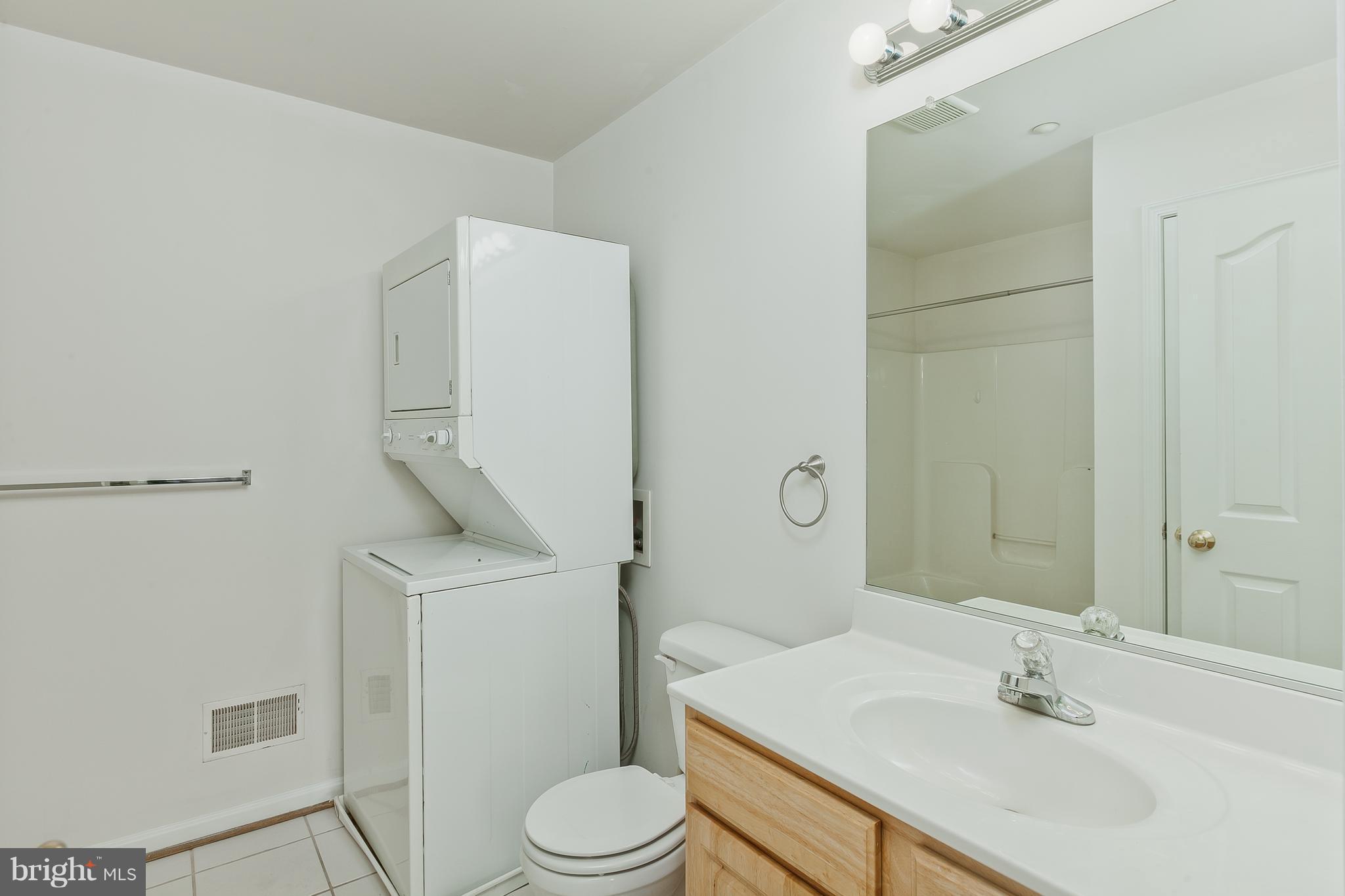 14613 Toll Road New Windsor, MD 21776 - Photo 17 of 30 a bathroom with a sink toilet and shower