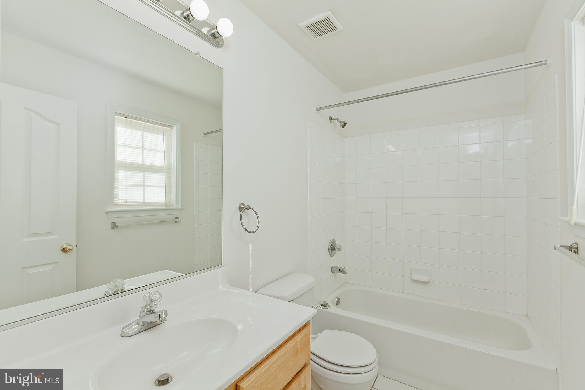 14613 Toll Road New Windsor, MD 21776 - Photo 25 of 30 a bathroom with a sink a toilet and a bathtub