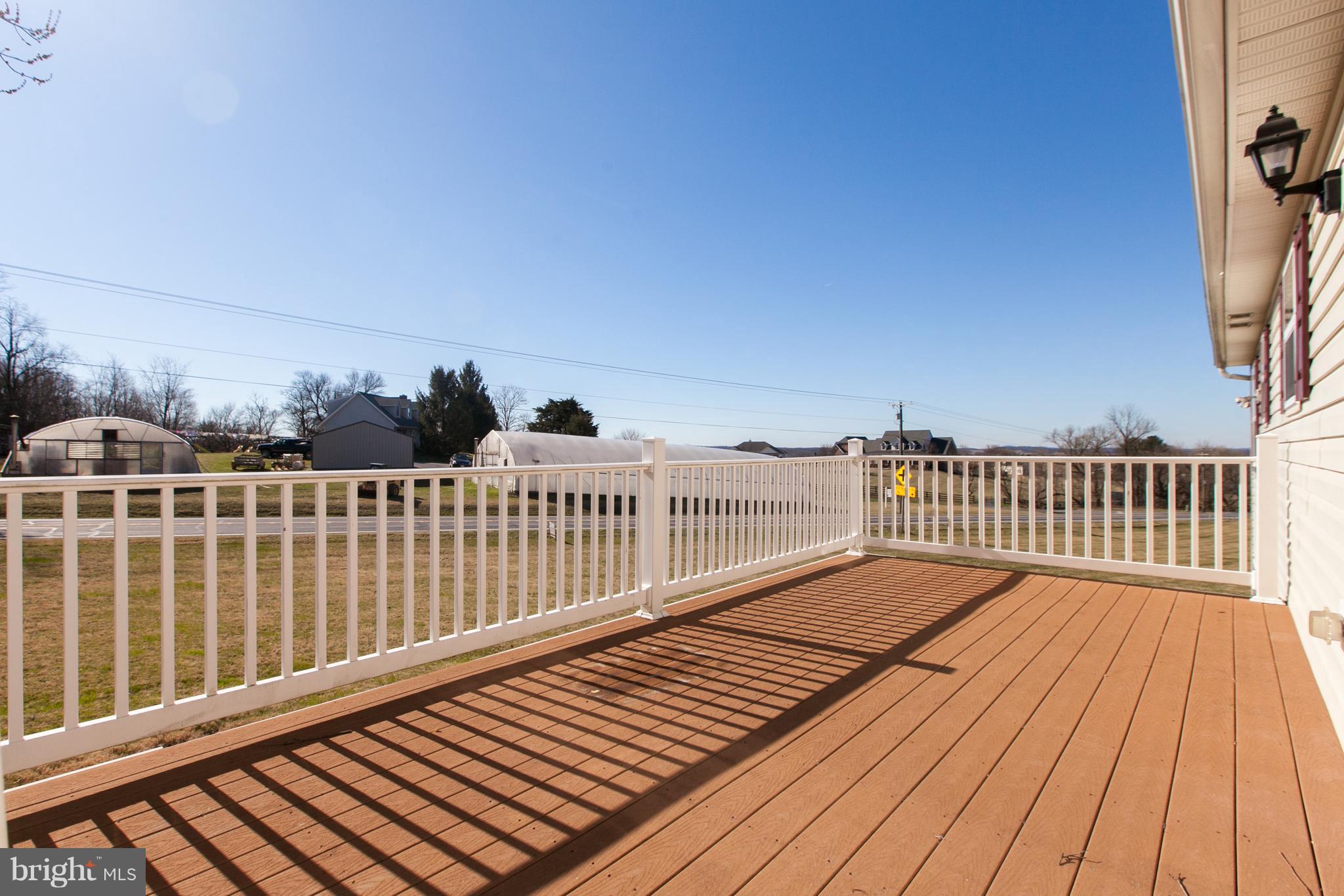 14613 Toll Road New Windsor, MD 21776 - Photo 26 of 30 a balcony with wooden floor