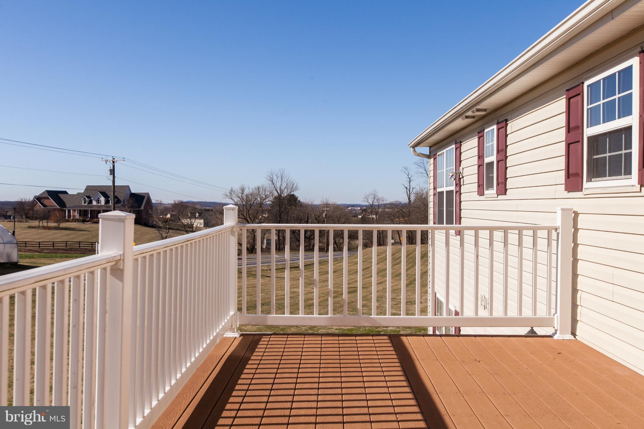 14613 Toll Road New Windsor, MD 21776 - Photo 27 of 30 a view of a balcony with wooden floor