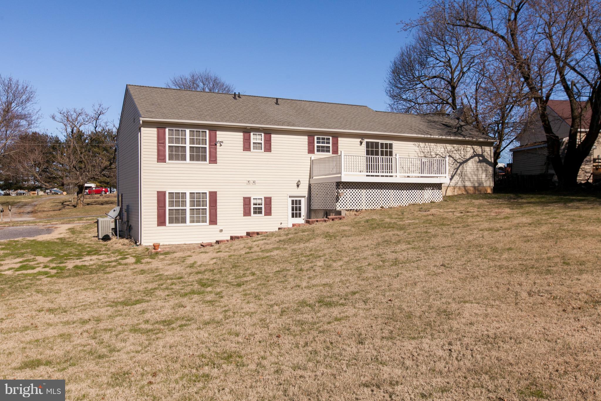 14613 Toll Road New Windsor, MD 21776 - Photo 28 of 30 a large white house with a large tree in front of it