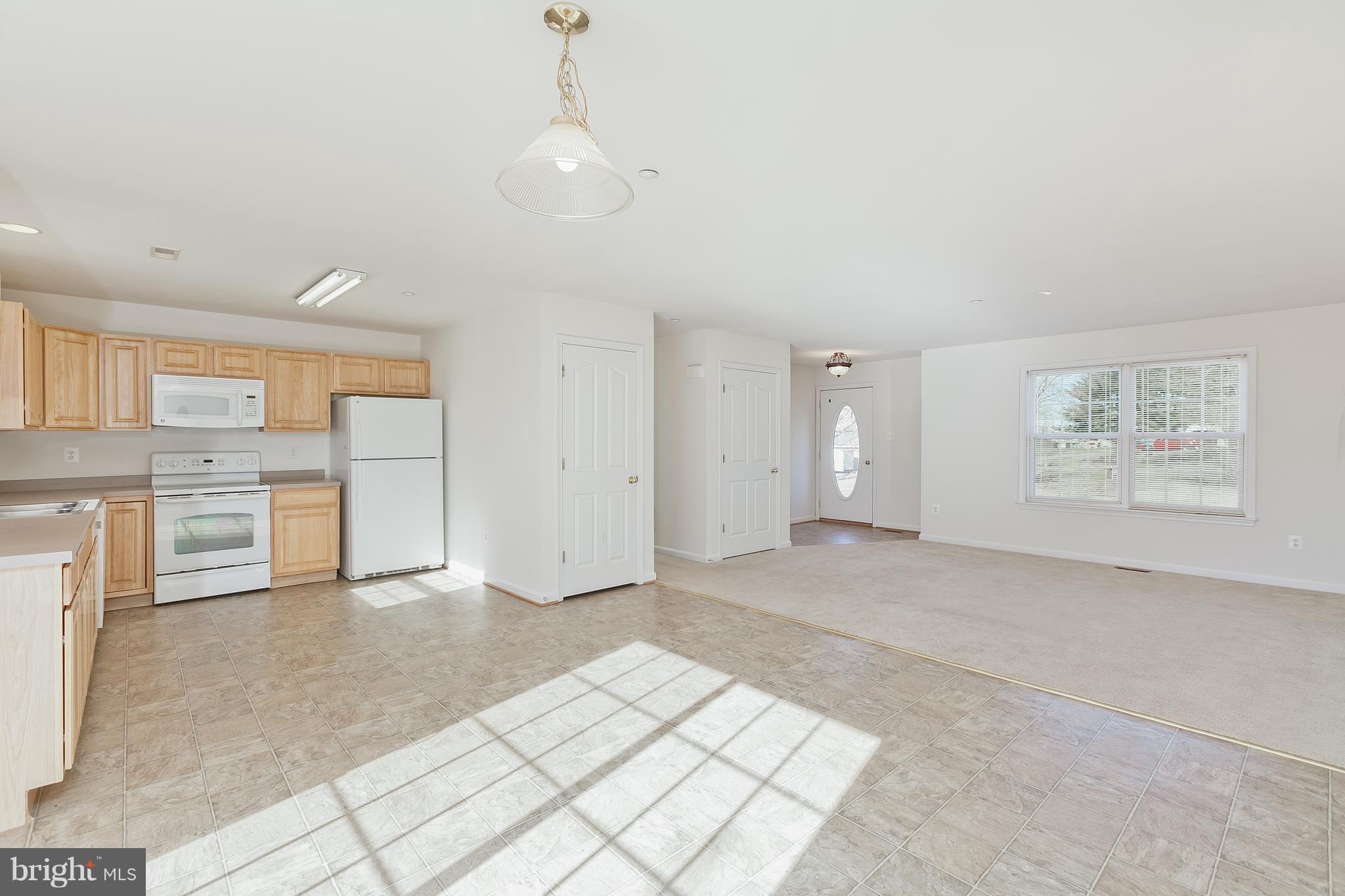 14613 Toll Road New Windsor, MD 21776 - Photo 10 of 30 a view of a kitchen with refrigerator and window