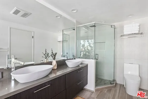 a bedroom with a bed and a fireplace