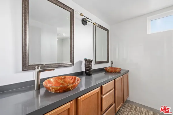 an aerial view of a houses with a swimming pool