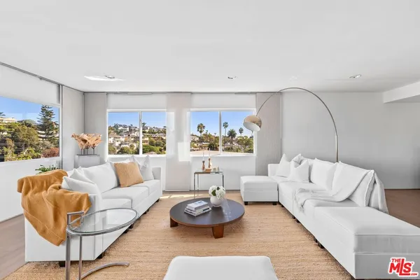 a kitchen with stainless steel appliances a stove sink and cabinets
