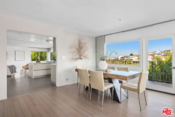 a bathroom with a double vanity sink toilet and shower