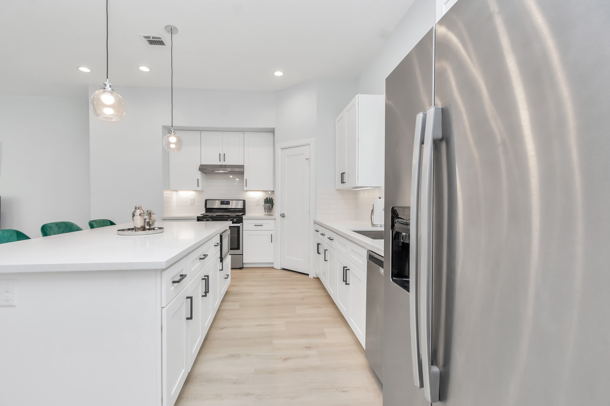 3310 Pease Street, Unit B Houston, TX 77003 - Photo 13 of 50 a kitchen with stainless steel appliances granite countertop a refrigerator and a sink