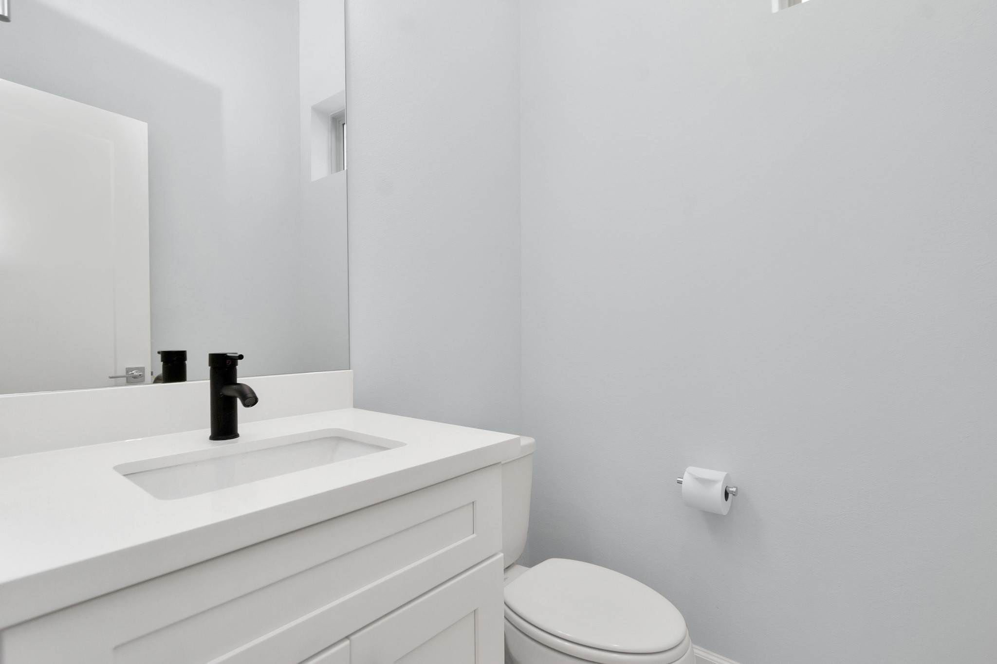 3310 Pease Street, Unit B Houston, TX 77003 - Photo 26 of 50 a bathroom with a sink a toilet and mirror