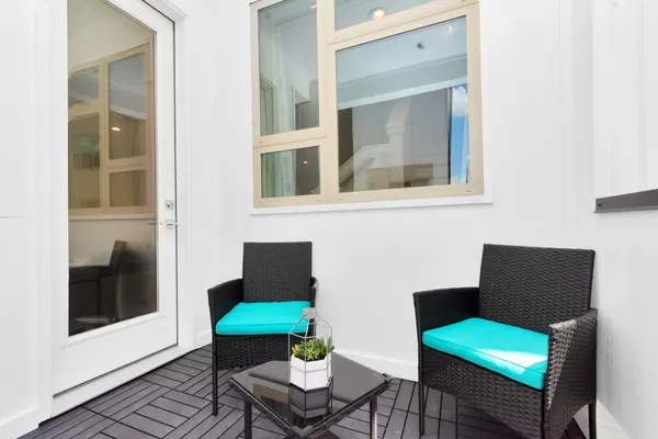 a living room with furniture and a window