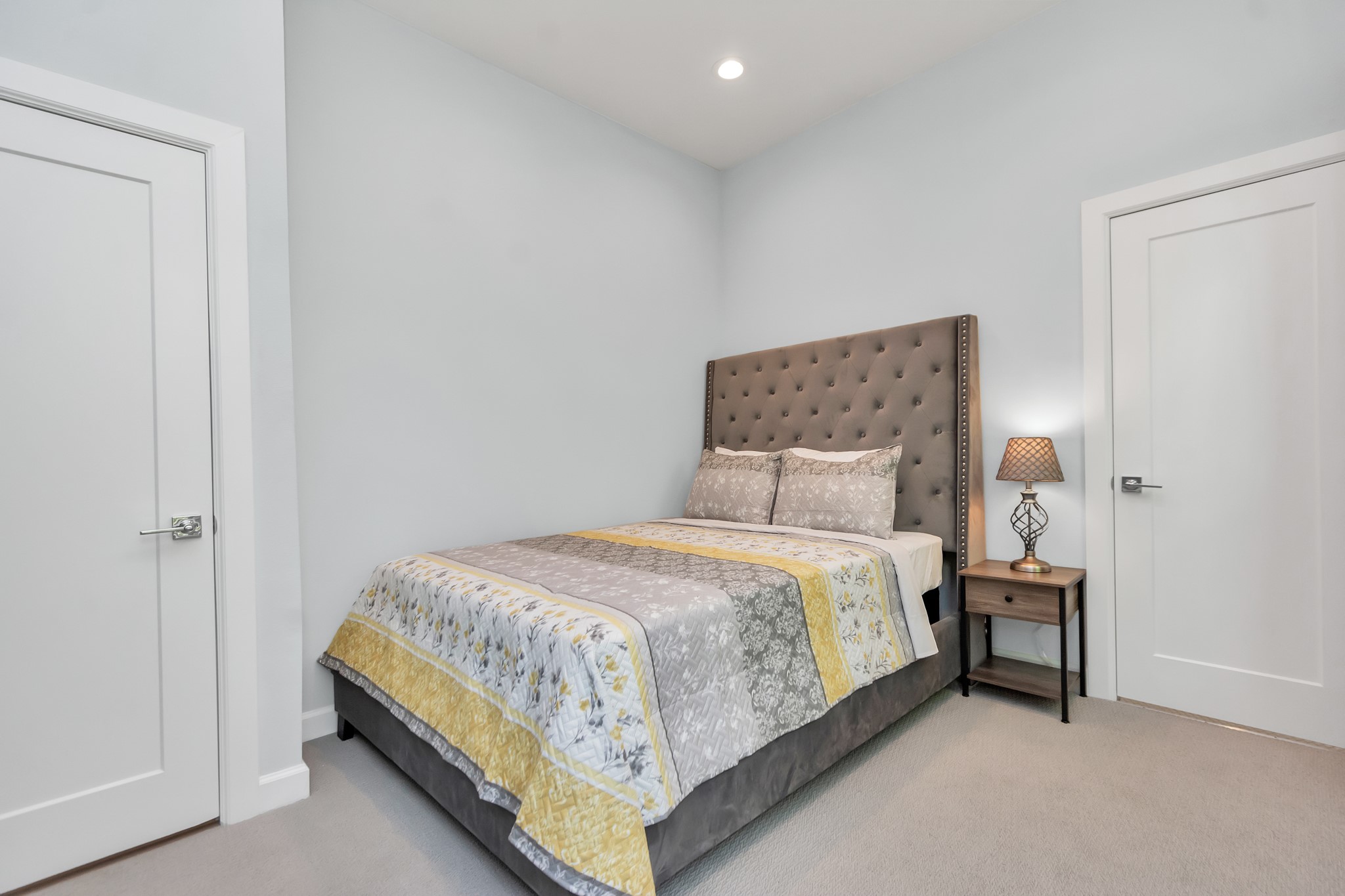 3310 Pease Street, Unit B Houston, TX 77003 - Photo 30 of 50 a bedroom with a bed and a night stand