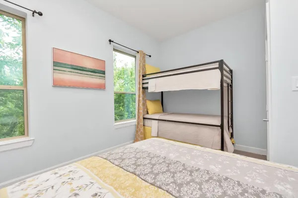 a bedroom with a bed and a dresser