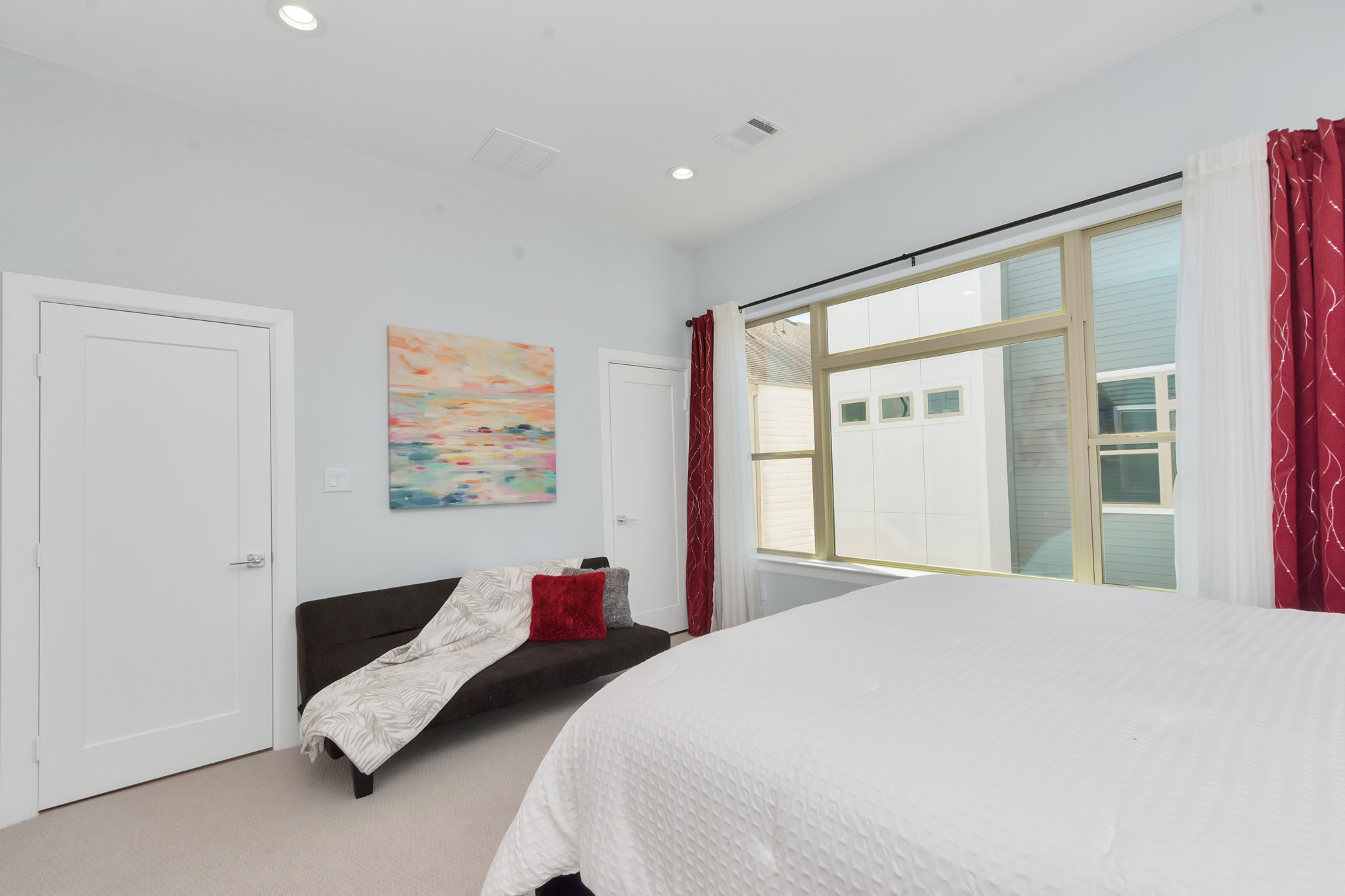 3310 Pease Street, Unit B Houston, TX 77003 - Photo 37 of 50 a bedroom with a bed and glass window