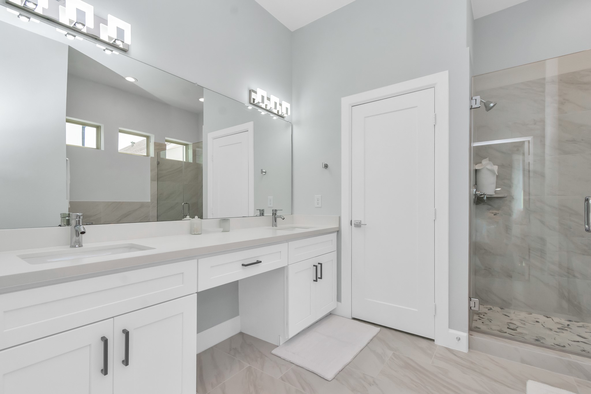 3310 Pease Street, Unit B Houston, TX 77003 - Photo 39 of 50 a bathroom with a double vanity sink mirror and shower