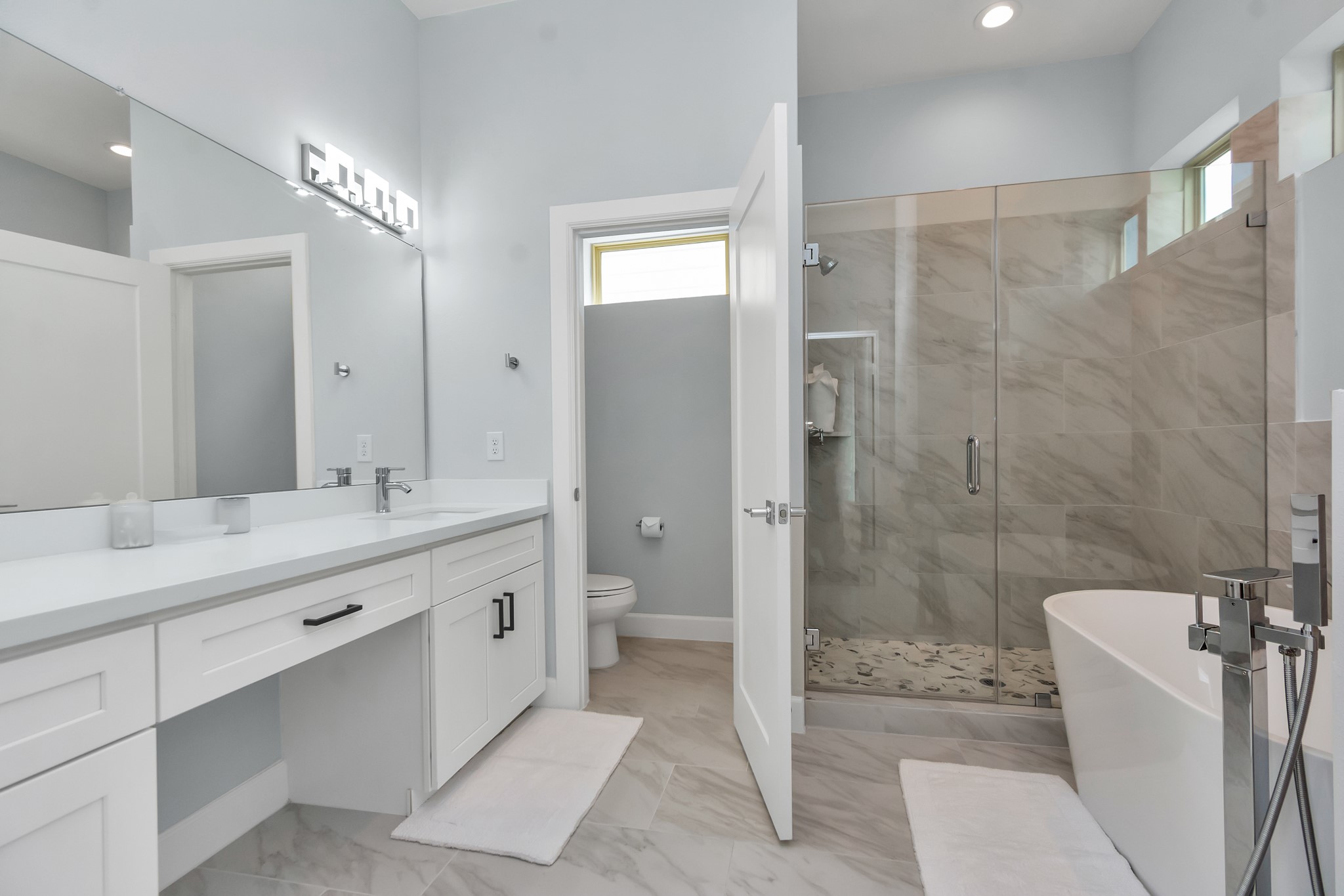 3310 Pease Street, Unit B Houston, TX 77003 - Photo 41 of 50 a bathroom with a double vanity sink toilet and shower