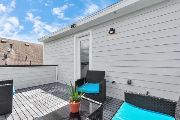 a view of a deck with furniture