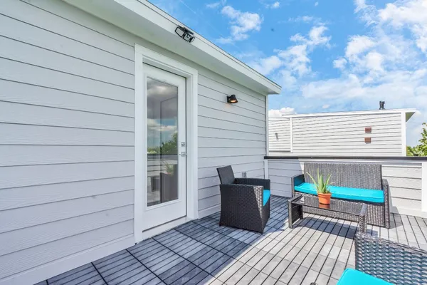 a view of backyard with sitting area