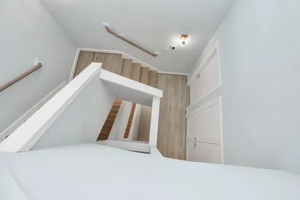a view of staircase and hallway