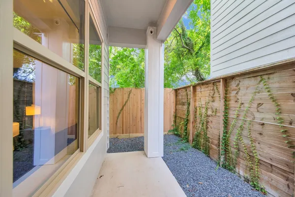 a view of a balcony with wooden floor and outdoor space