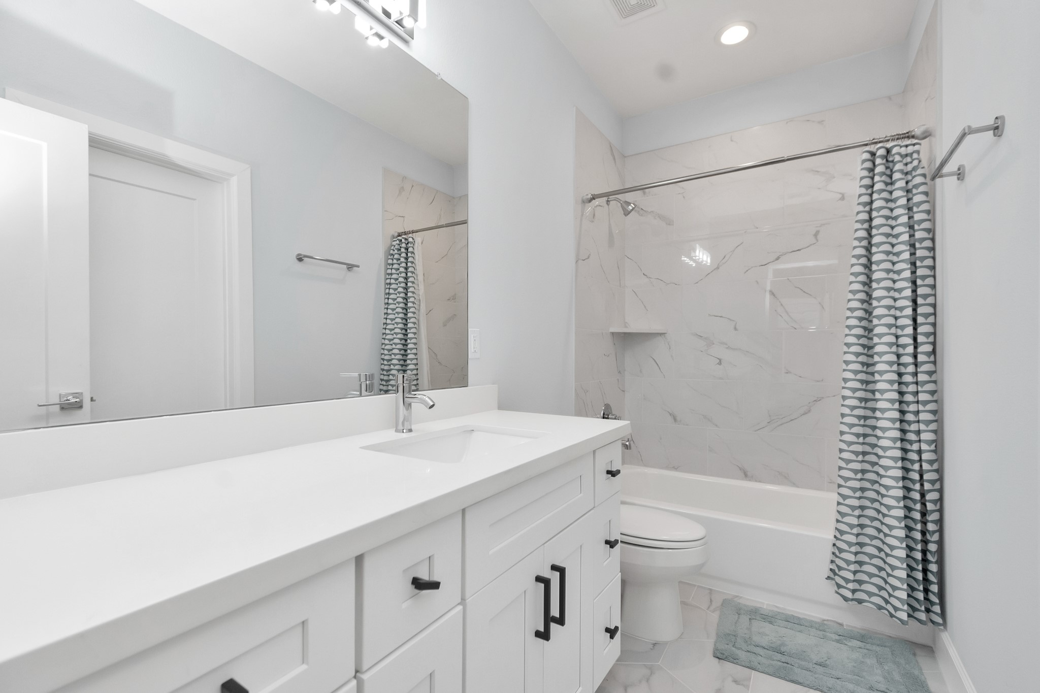 3310 Pease Street, Unit B Houston, TX 77003 - Photo 9 of 50 a bathroom with a sink a toilet and shower