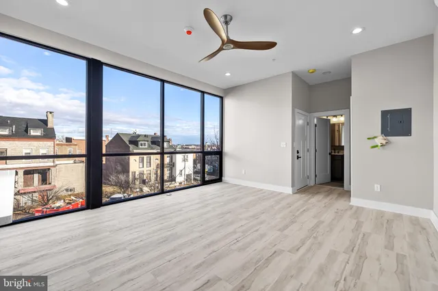 a view of an empty room with a window