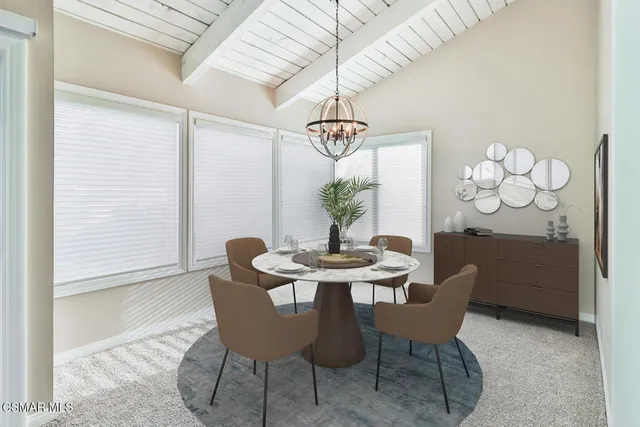 a dining room with furniture and window