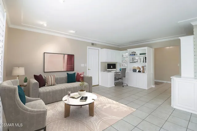 a living room with furniture and white walls