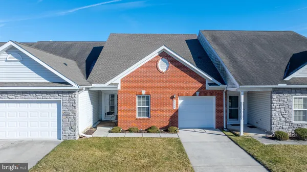 a front view of a house with garage