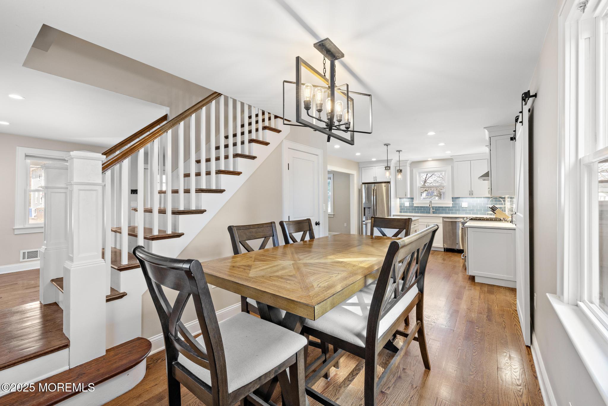 218 Cooper Road Red Bank, NJ 07701 - Photo 12 of 43 a view of a dining room with furniture and wooden floor