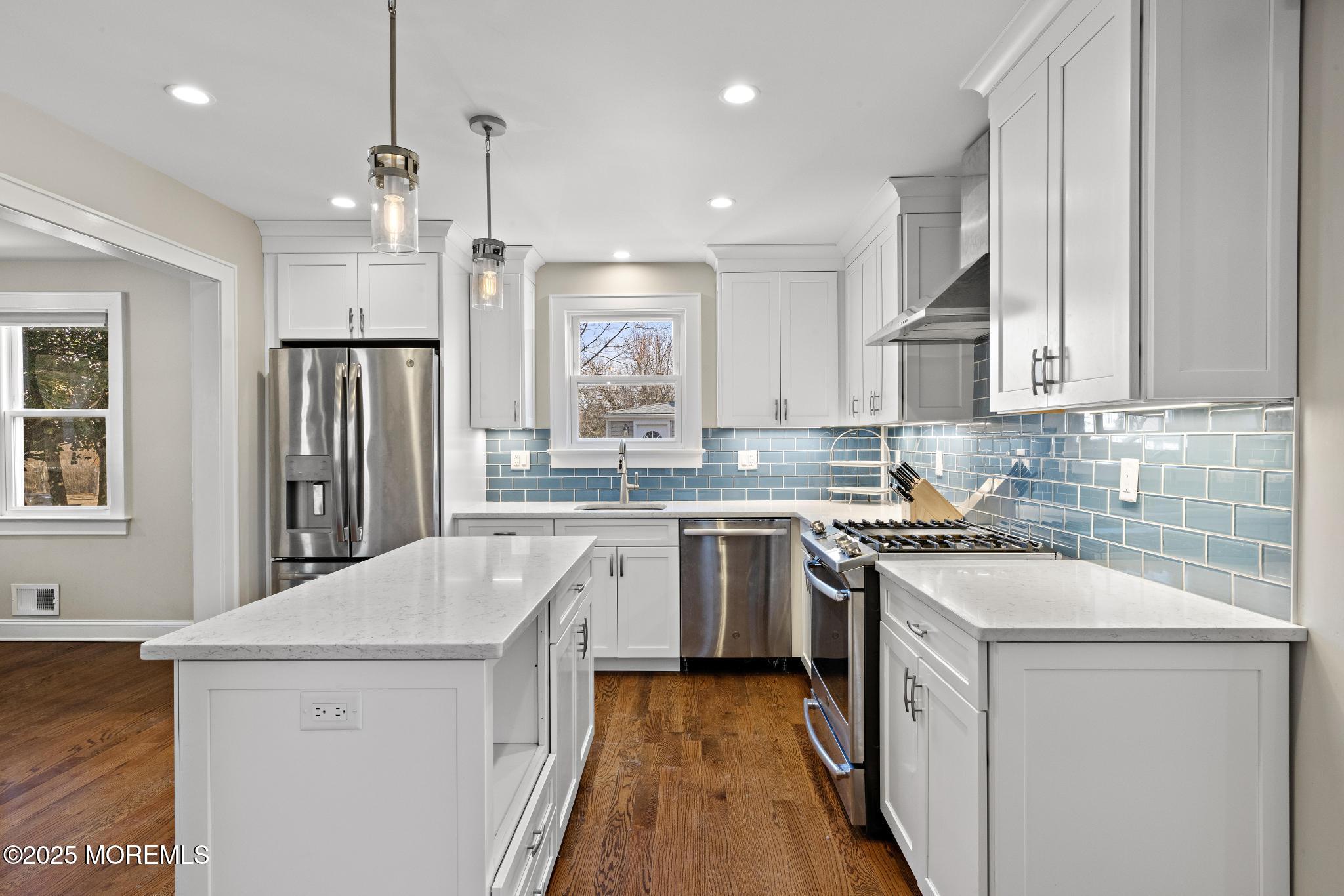 218 Cooper Road Red Bank, NJ 07701 - Photo 13 of 43 a kitchen with granite countertop a sink stove and refrigerator