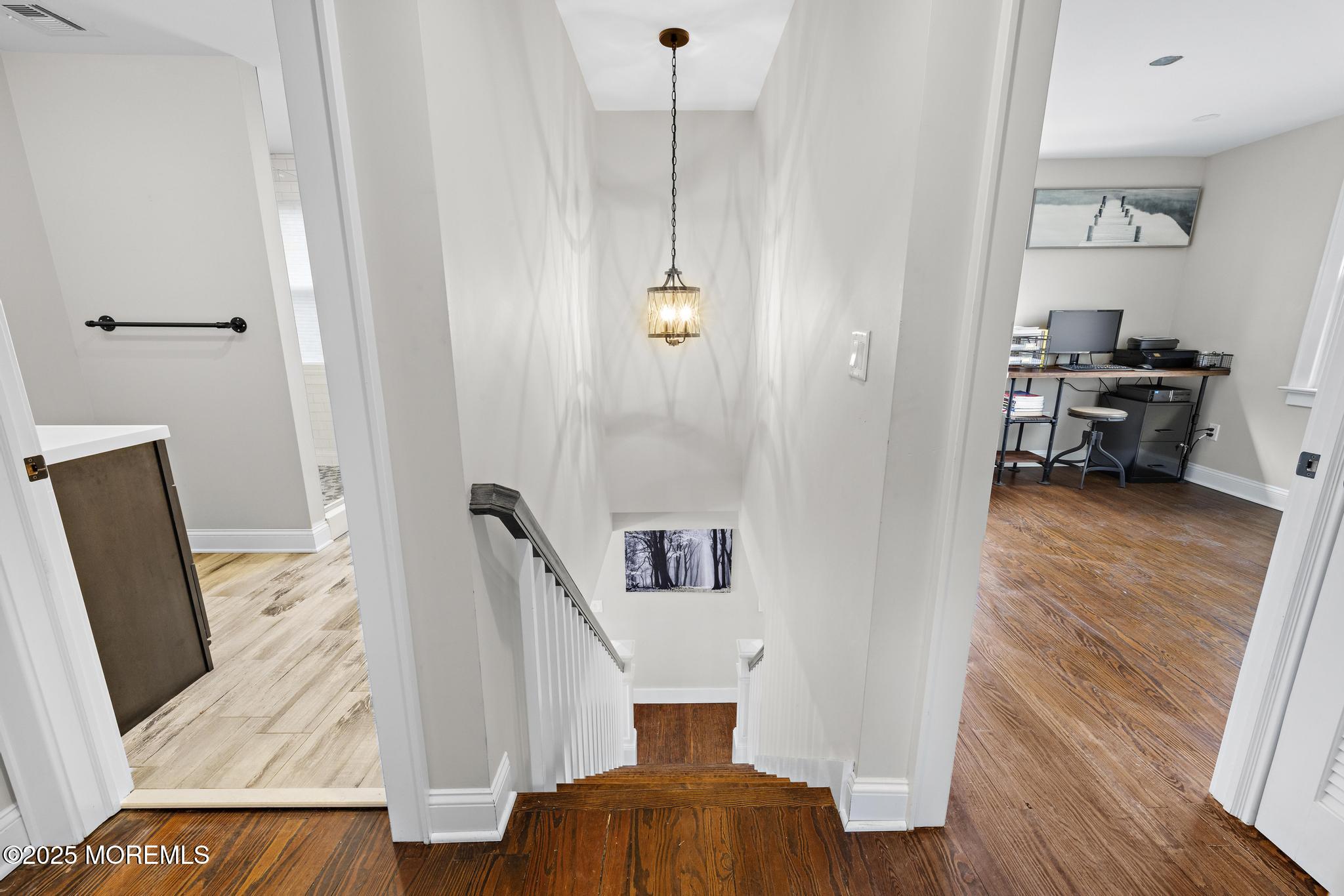 218 Cooper Road Red Bank, NJ 07701 - Photo 22 of 43 a view of a hallway with furniture and wooden floor