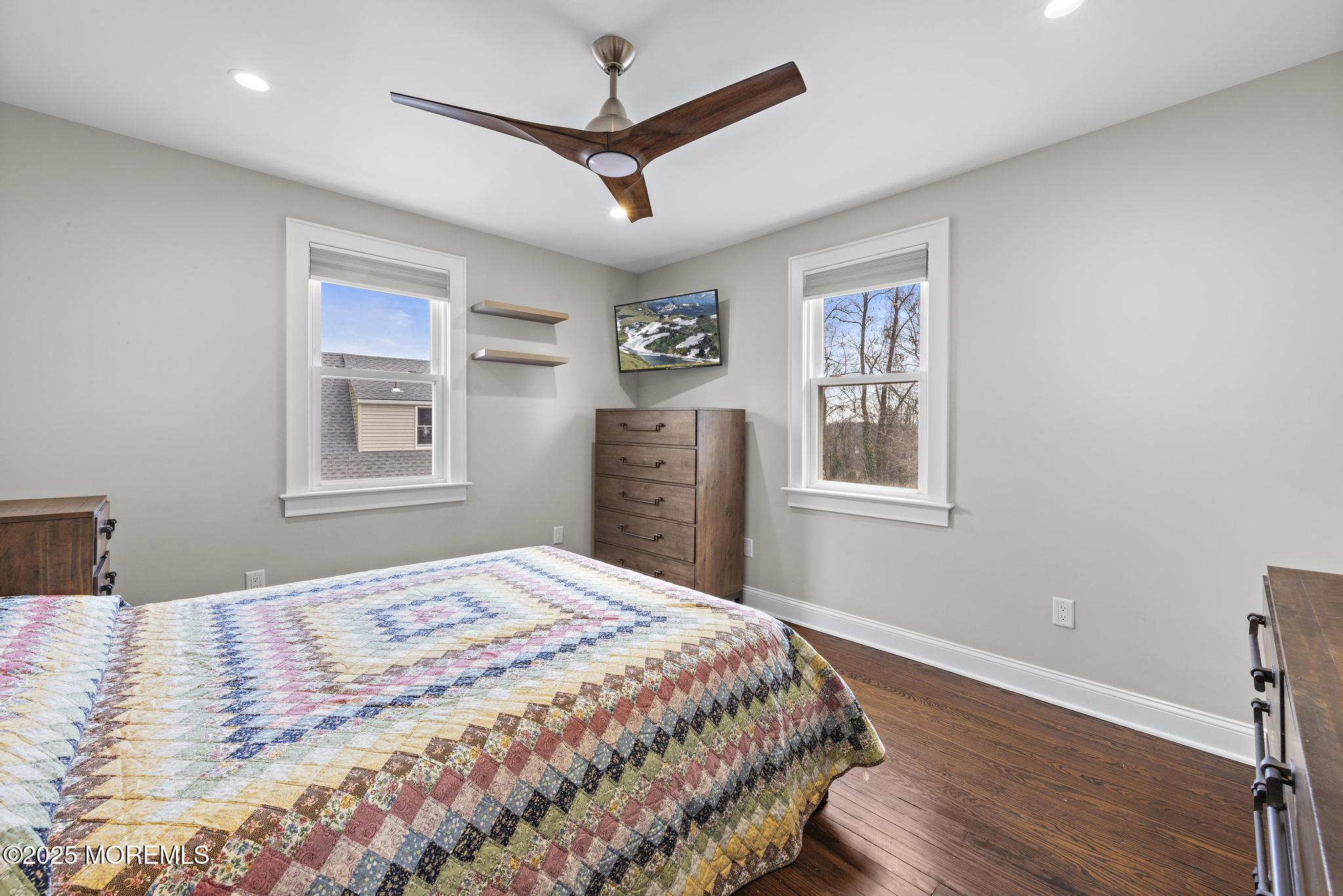218 Cooper Road Red Bank, NJ 07701 - Photo 23 of 43 a bedroom with a large bed and a window
