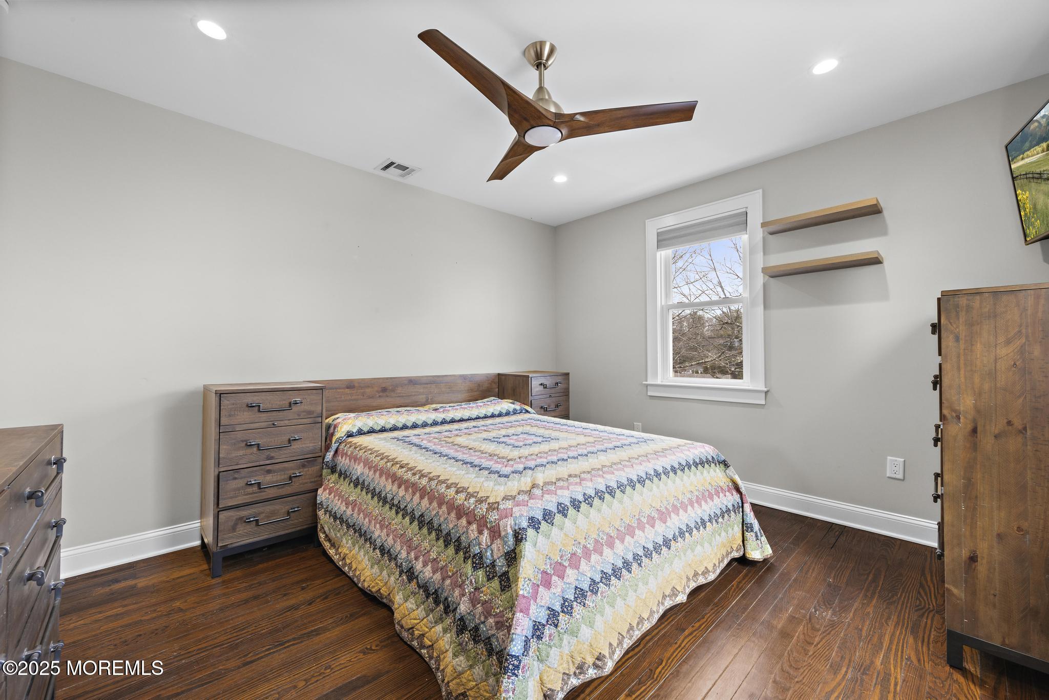 218 Cooper Road Red Bank, NJ 07701 - Photo 24 of 43 a bedroom with a bed and a window