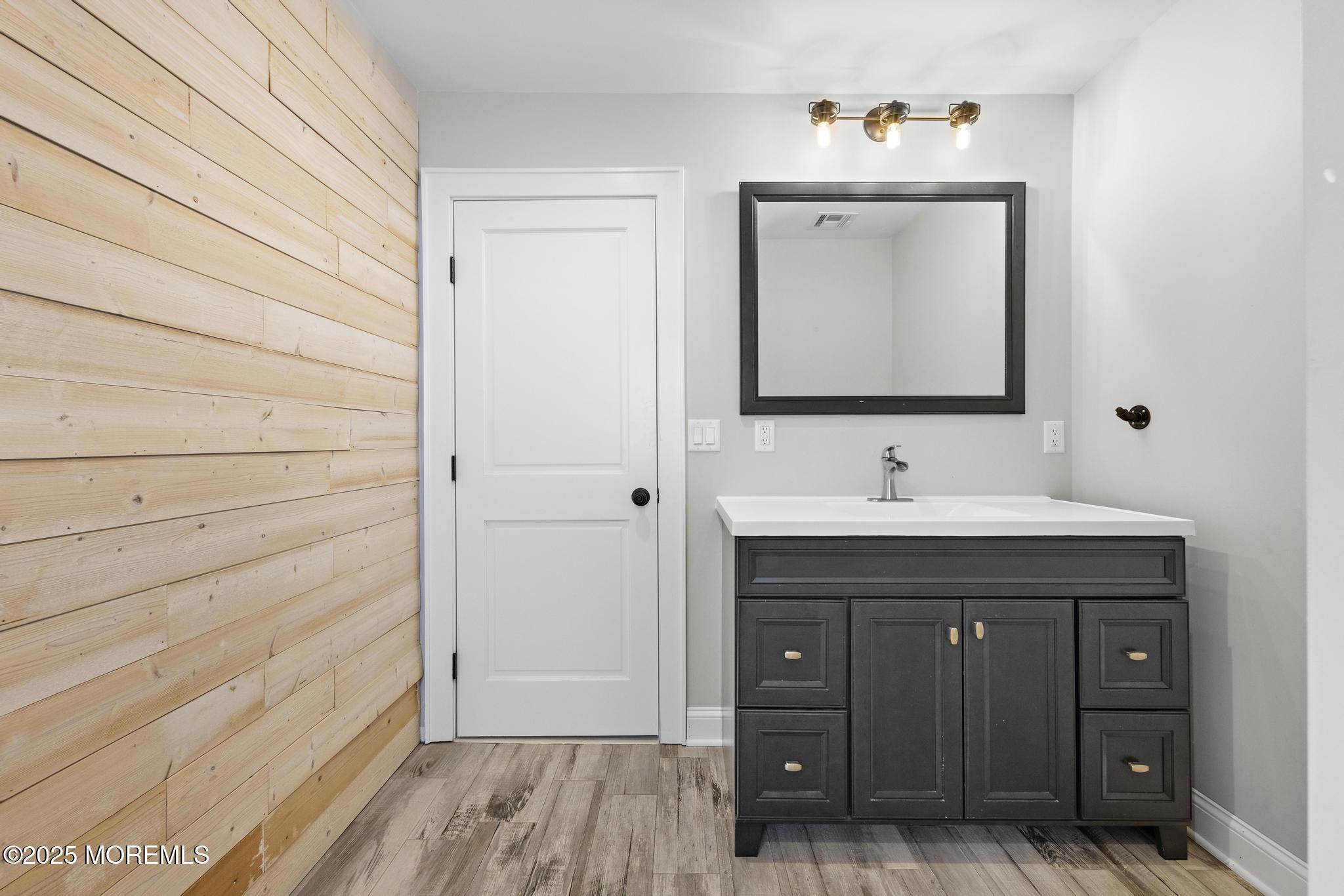 218 Cooper Road Red Bank, NJ 07701 - Photo 29 of 43 a bathroom with a sink and a mirror