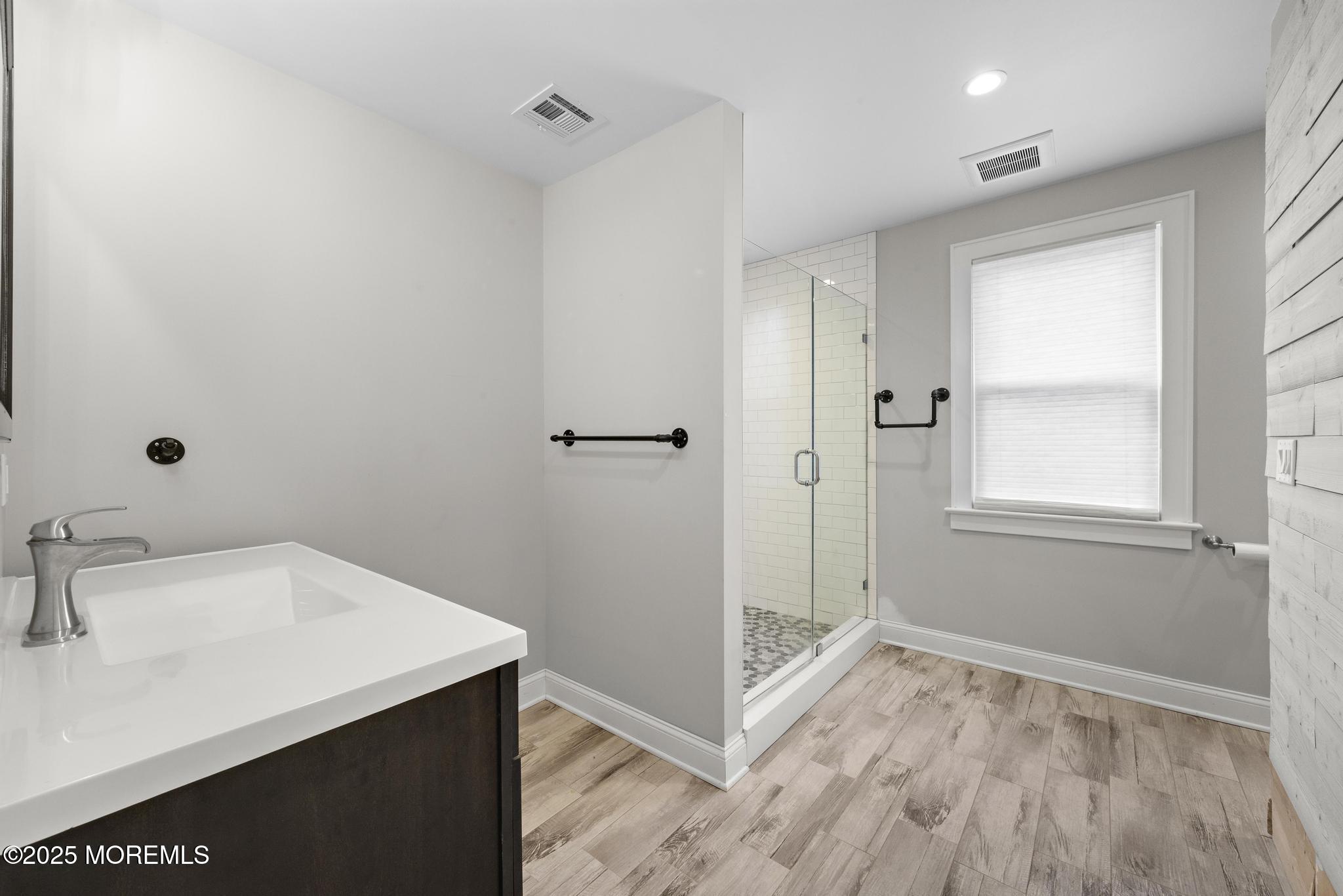 218 Cooper Road Red Bank, NJ 07701 - Photo 30 of 43 a bathroom with a sink and a mirror