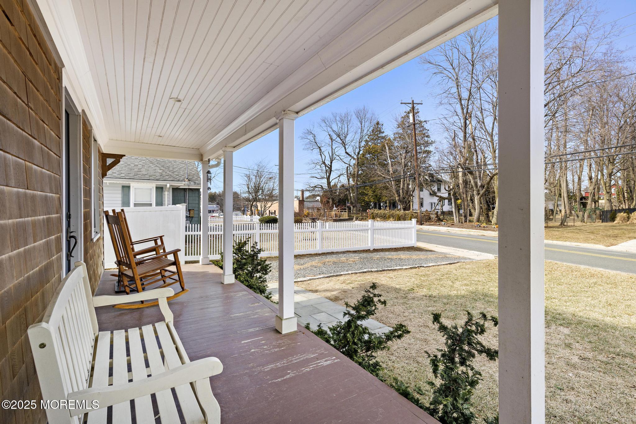218 Cooper Road Red Bank, NJ 07701 - Photo 4 of 43 a view of a porch with chairs and backyard