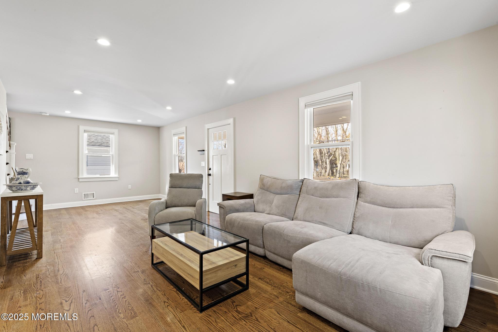 218 Cooper Road Red Bank, NJ 07701 - Photo 5 of 43 a living room with furniture and a couch