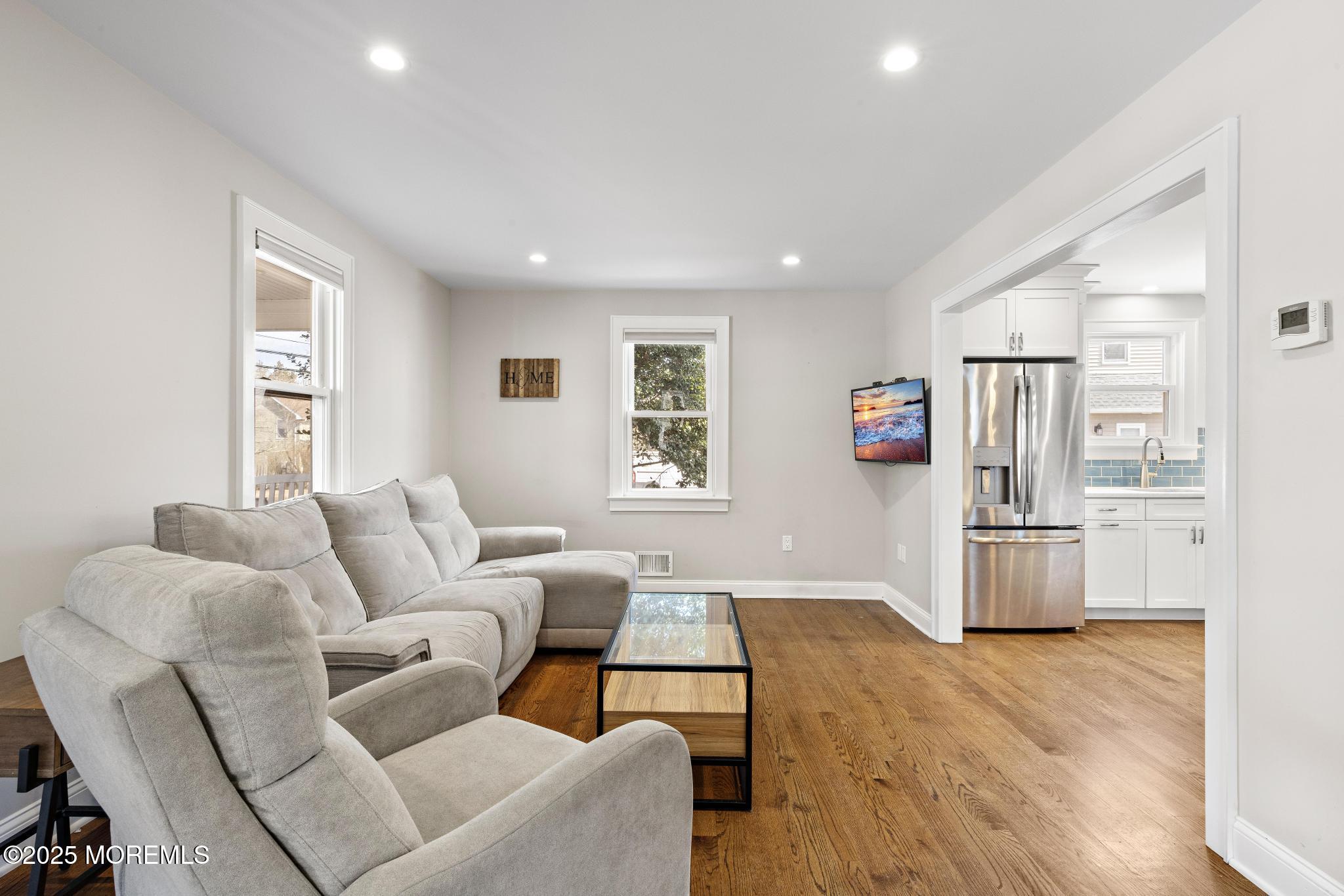 218 Cooper Road Red Bank, NJ 07701 - Photo 6 of 43 a living room with furniture and stainless steel appliances