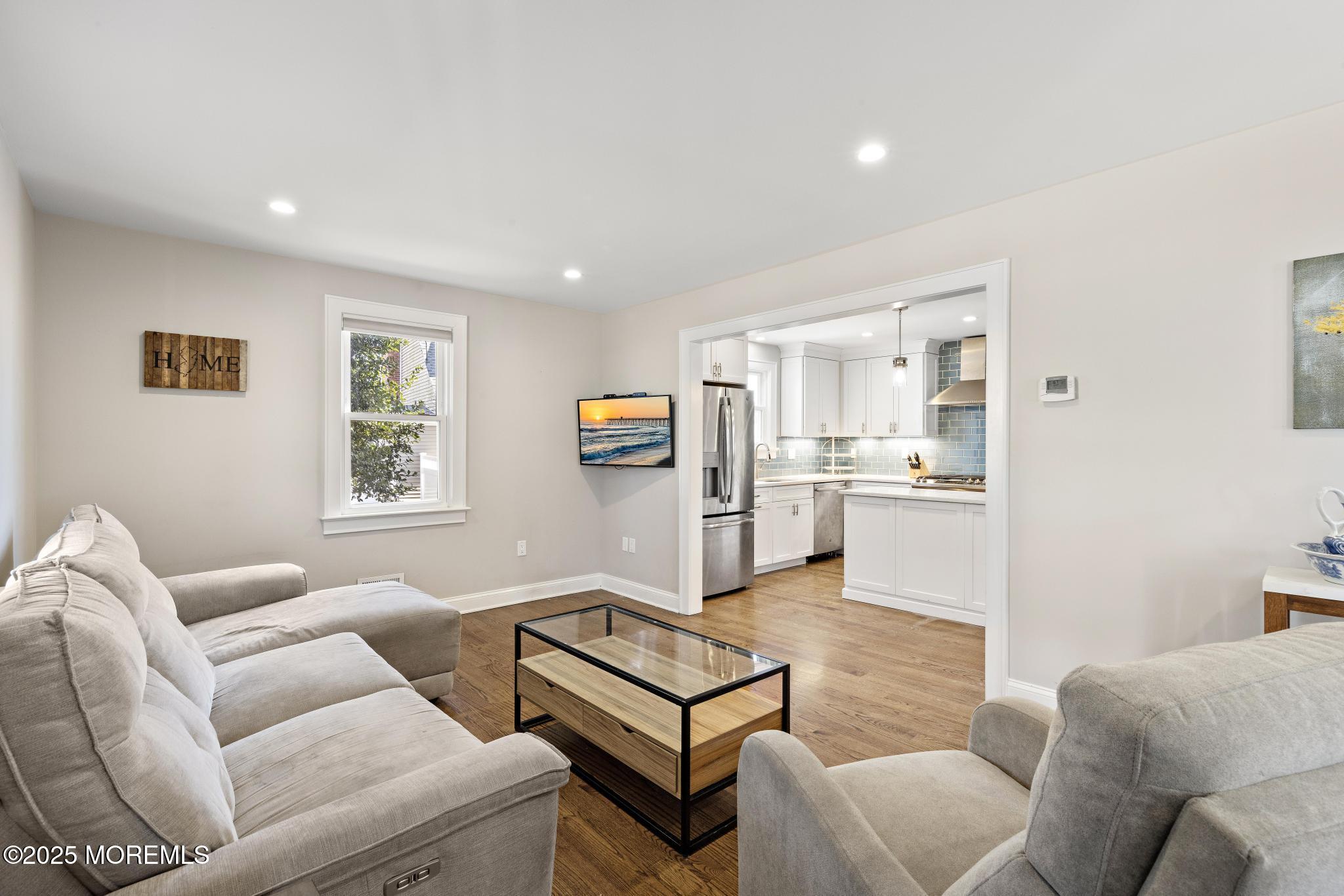 218 Cooper Road Red Bank, NJ 07701 - Photo 7 of 43 a living room with furniture and kitchen view