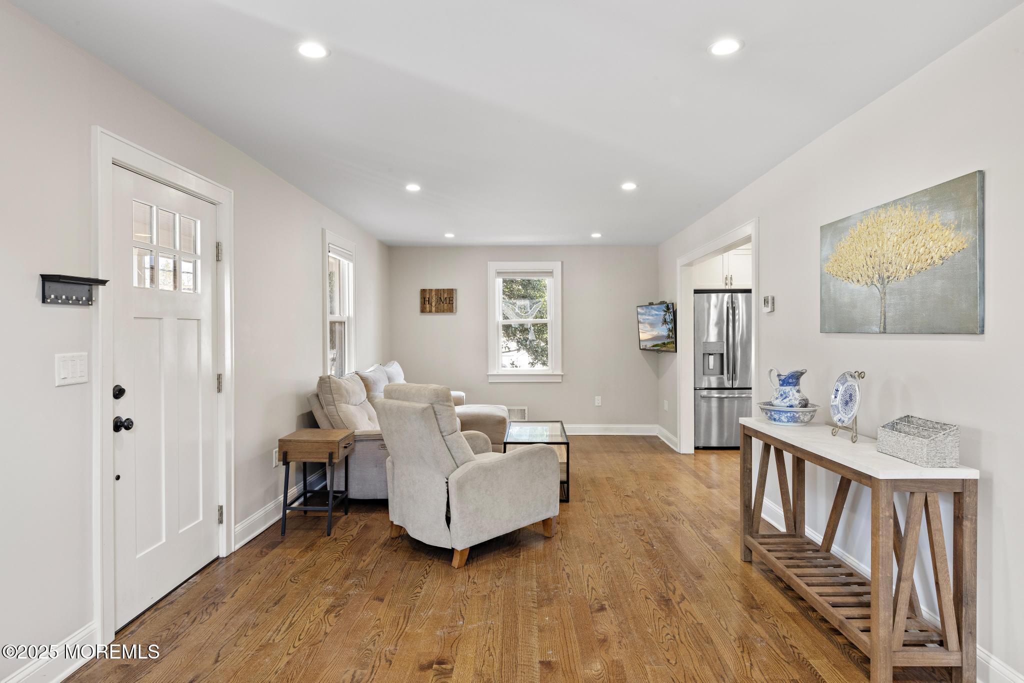 218 Cooper Road Red Bank, NJ 07701 - Photo 8 of 43 a living room with furniture and a wooden floor