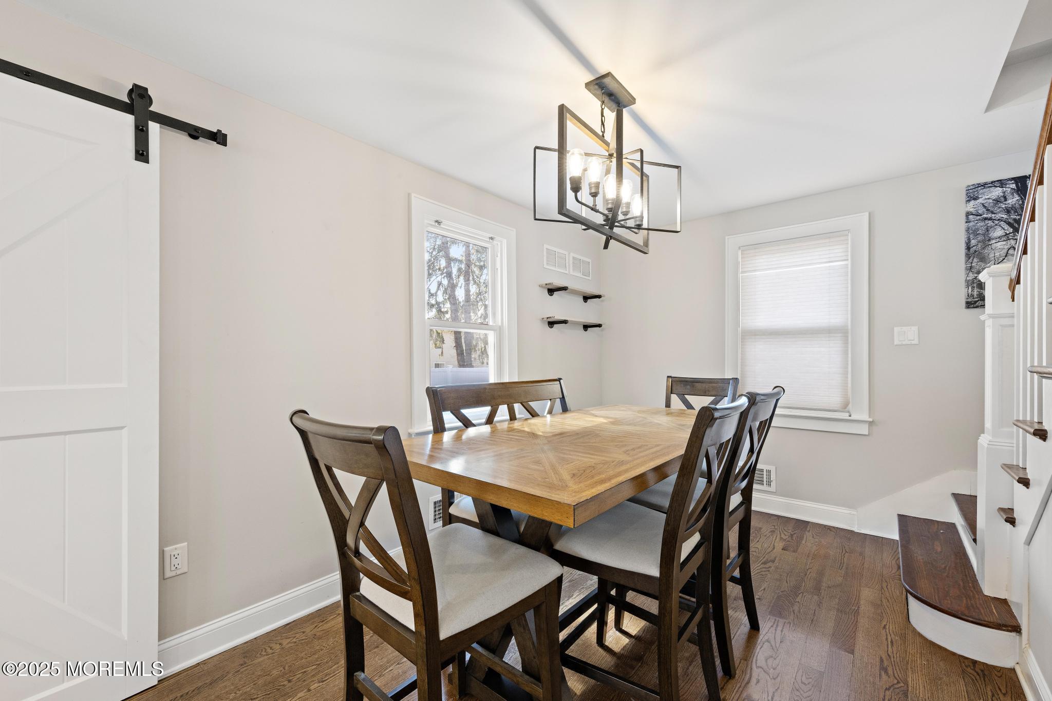 218 Cooper Road Red Bank, NJ 07701 - Photo 10 of 43 a view of a dining room with furniture and a chandelier