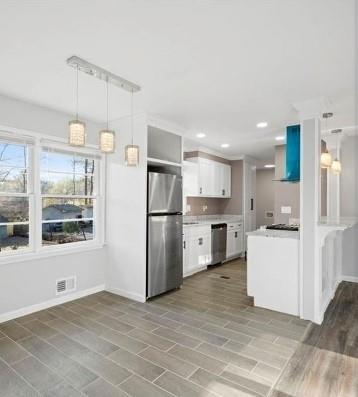 4419 Richard Road Conley, GA 30288 - Photo 4 of 6 a kitchen with white cabinets and white appliances