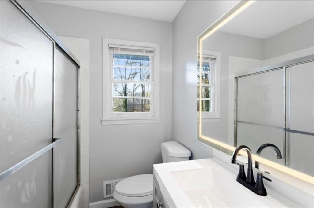 4419 Richard Road Conley, GA 30288 - Photo 5 of 6 a bathroom with a sink toilet and shower