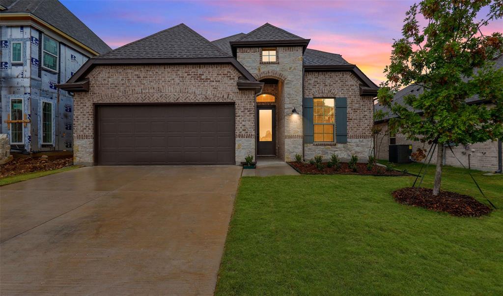 1234 Stagecoach Trail Justin, TX 76247 - Photo 1 of 1 a front view of a house with a yard