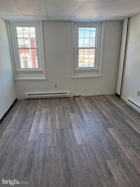 103 Cumberland Street, Unit 2 Clear Spring, MD 21722 - Photo 4 of 8 an empty room with wooden floor and windows