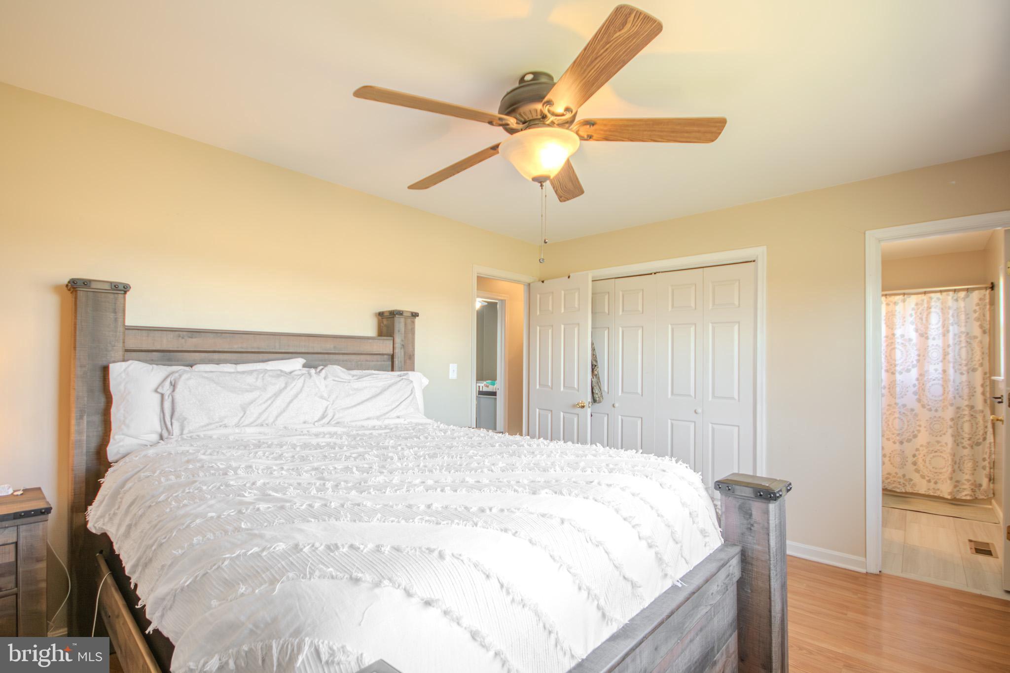 38079 Road 504 Delmar, DE 19940 - Photo 15 of 29 a large bed sitting in a bedroom next to a window