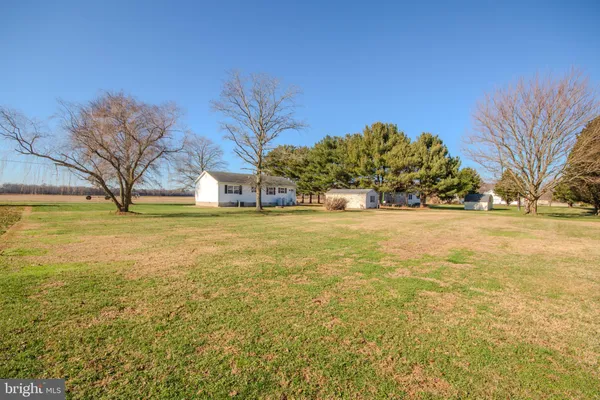 a view of a swimming pool with an outdoor space and seating area