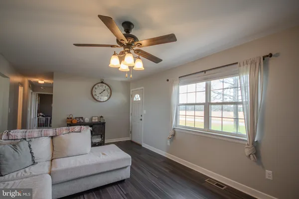a living room with furniture and a window